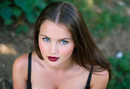 (((analog photo))) brunette (((slavic cleavage))) woman outdoors, blue eyes, glossy dark lipstick, (((soft focus, depth of field, film grain, masterpiece, looking at viewer))) <lora:EuroBabe-v4-XL:0.66>