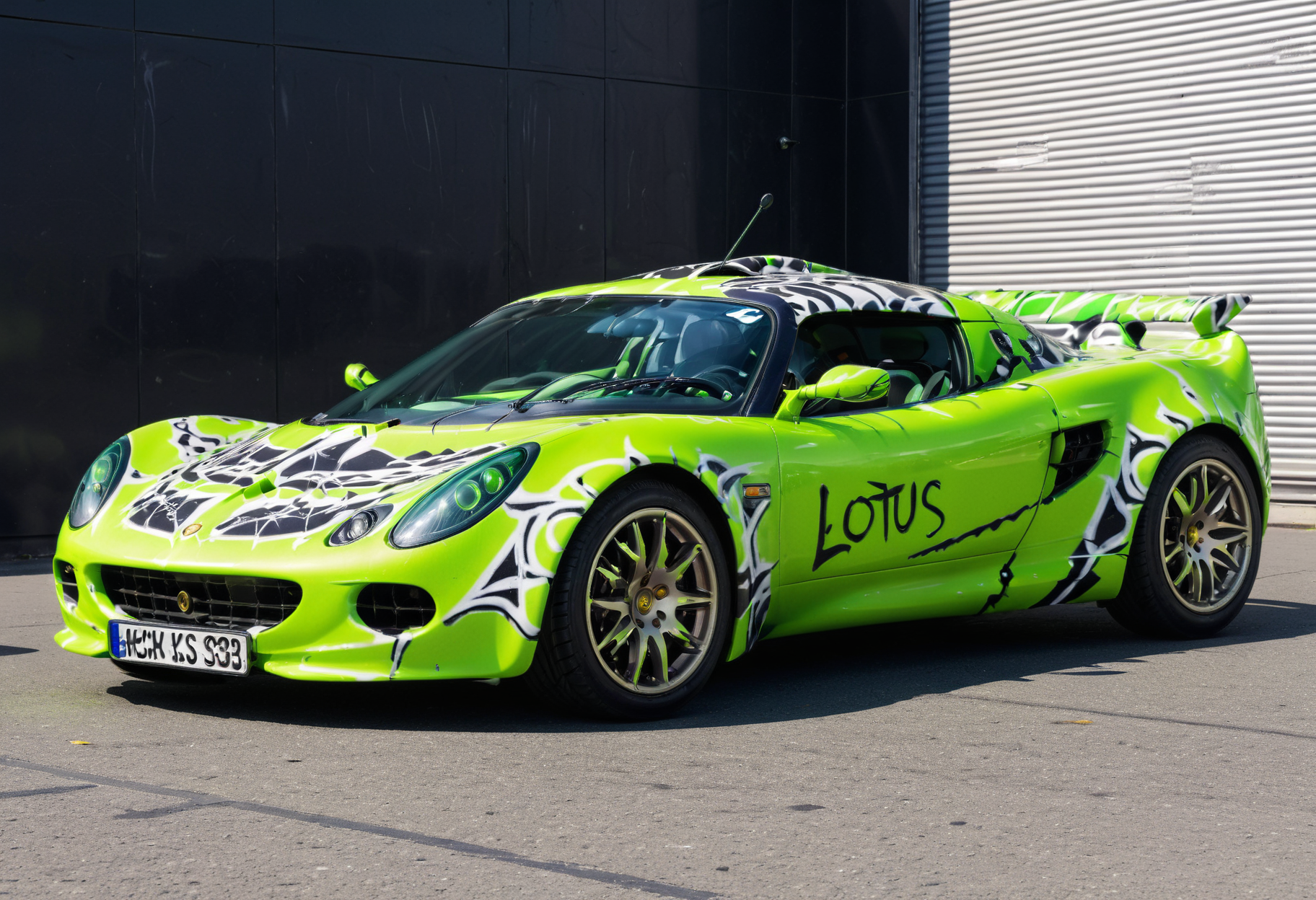 lgcrs,a  car lotus looking like a shark, with aggressive color pattern,neon green and blacks,parked a black marble surface, before a silver sphere,with headlights on, graffiti like
<lora:Retro_Cars-000011:0.8>,