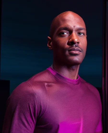 photograph of, 1man, <lora:rhyheimsv3:1> rhyheims, black man, dark skin, facial hair, bald, portrait, best quality, 4K, masterpiece, detailed, intricate, blue and purple and pink, perfect anatomy, by professional artist, realistic,
<lora:add_detail:1>, purple shirt, bisexual neon lighting,