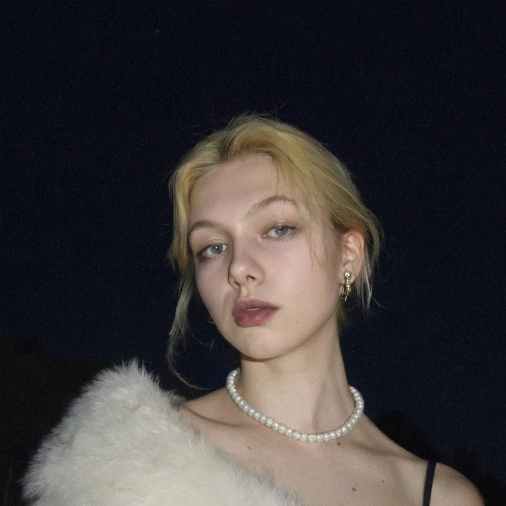hunter schafer, amateur photo, 1986, vintage Photobooth, grainy, (detailed facial features), (freckles:0.05), (acne:0.025), platin yellow mullet hair, young woman, sharp featured face, light blue lipstick, pale skin, tired face, white Faux Fur Off The Shoulder Dress, pearl earrings and pearl necklace, emme frost, porn fantasy, tight body, low angle shot, worm's ankle shot, film grain, night outside, <lora:leaked_nudes_style_v1_fixed:1>