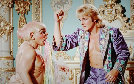 ArsMovieStill, movie still from a pastel-colored 1890s Rococo fantasy opera movie, in which gross troll e.t. the extra-terrestrial alien character with food poisoning is leaning over and vomiting large quantities of rainbow pastel blood and is savagely hit in the head from behind, violently struck by a badass blonde mullet haired angry Greg Valentine man in a purple velvet entrance robe with turquoise sequined hearts on it running with his right arm raised up in a brutal Hammer Elbow pose (colliding with e.t. the extra-terrestrial alien character). Ornate and intricate decor. Suffer alien character.