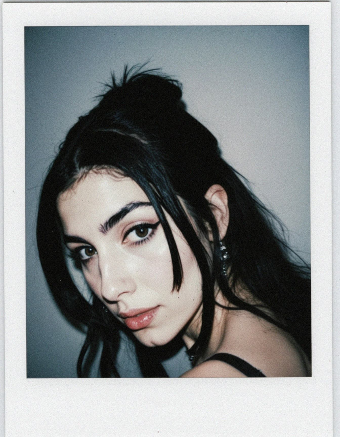 erotic, middle eastern woman, pale skin, iranian woman, half-up half-down hairstyle, black hair color, Polaroid instant film aesthetic, soft focus, slightly desaturated muted colors, distinctive cream thick border frame, uneven chemical development marks visible