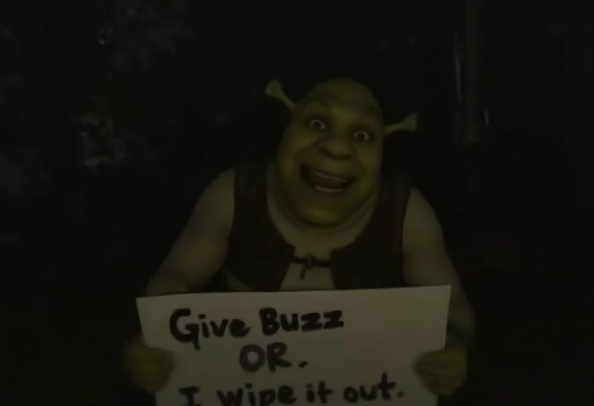 An omegle.com webcam taken at night of Shrek in a swamp smiling a very wide, creepy, and extremely uncanny smile. It is dark. Holding a sign that says "Give Buzz or I wipe it out" <lora:lora09.TA_trained:1>