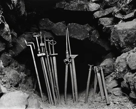 in a post-apocalyptic abandoned mine, blocked tunnel entrance, rusted tools., by Man Ray, SZ_4poXL enviroment   <lora:Post ApocalypticXL_v2:0.6>