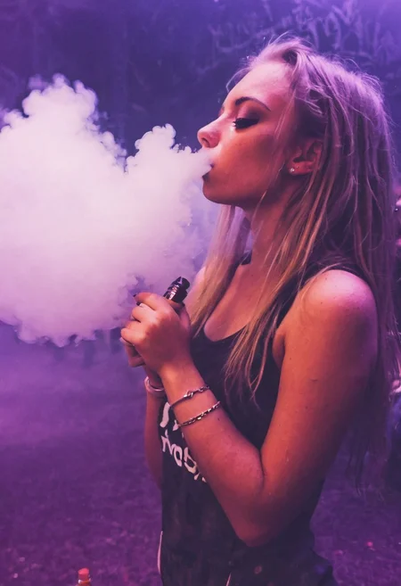 <lora:VapeXL-08:1.0> VapeXL, girl blowing smoke, rave
