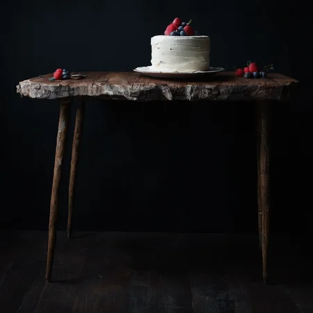 <lora:SDXL_black_and_color_Sa_May:1> a cake wood table