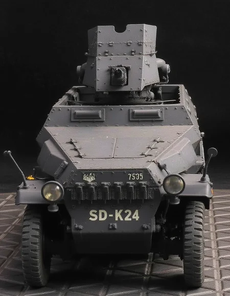 , <lora:sd-kfz-251-10:1>sd-kfz-251-10:ã
A German WWII combat vehicle equipped with a 37mm anti-tank gun on an open-top half-track.Three-quarter view.German identification mark of a cross. no humans.