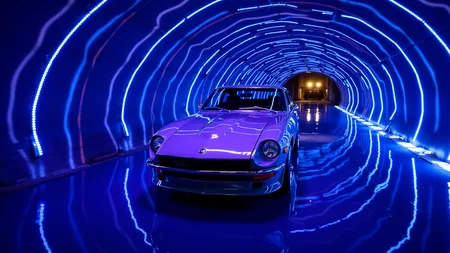 Inside a glowing, futuristic tunnel with pulsating LED light strips running along the walls, a 1972 Nissan Datsun 240Z Fairlady in polished silver stands poised. The carâs long hood and recessed headlights reflect the oscillating hues of blue and purple. The smooth, mirrored floor enhances the sleek design of the car, doubling its presence. A distant hum of an unseen vehicle echoes through the tunnel, adding a sense of mystery and anticipation to the high-tech atmosphere
<lora:ral-nssndtsn_000001000:1>