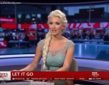 A blonde haired beautiful woman resembling elsa with a long platinum braid as a news anchor sits behind a desk in a BBC Newsroom, reading the latest headlines. The TV overlay says "BBC NEWS" with the headline "LET IT GO". <lora:Concept_morse-BBCNewsroom-FLUX:1>