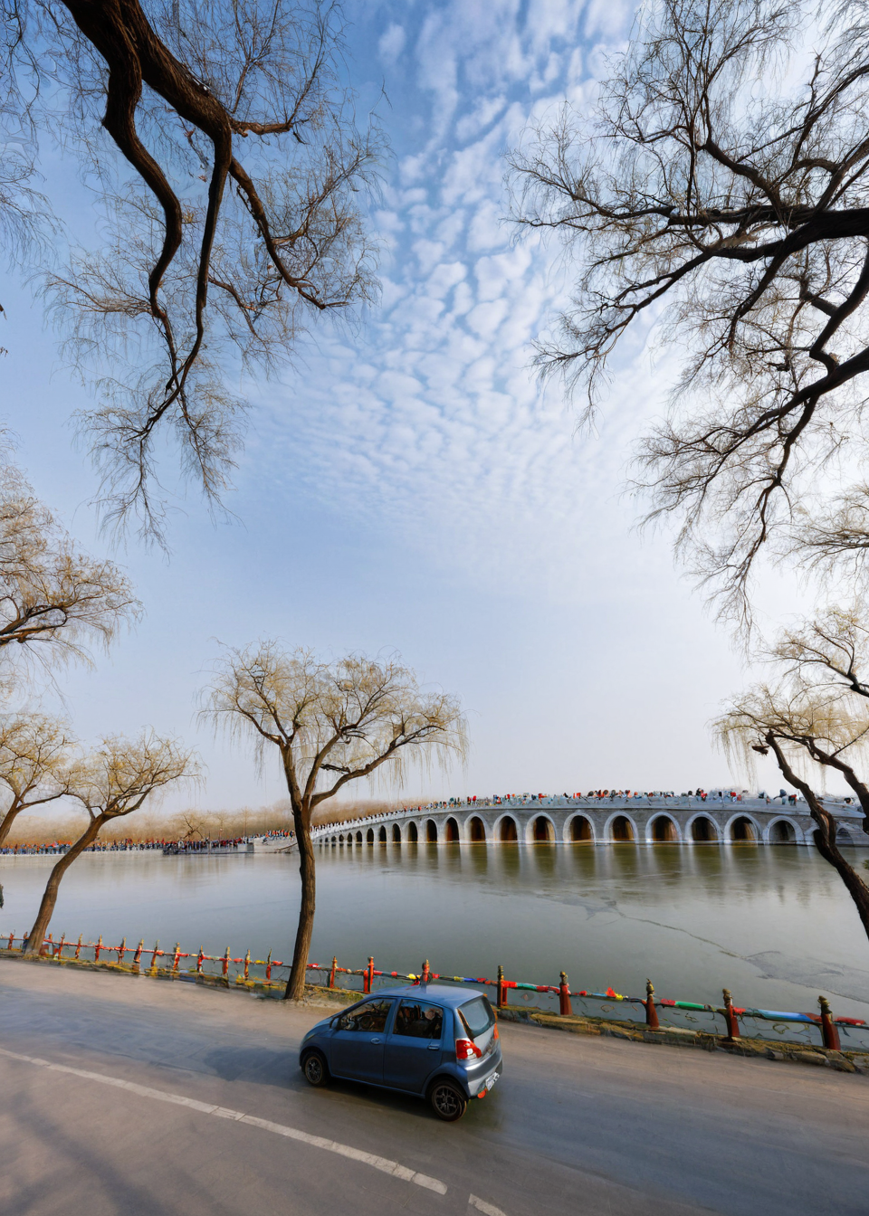 <lora:é¢åå­:1>,The Summer Palace, tree, scenery, bridge, outdoors, bare tree, multiple boys, car, ground vehicle, sky, motor vehicle, water, building, river, day, road, street, city, dutch angle, real world location, power lines, 6+boys, cloud, masterpiece, best quality,