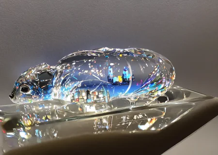 realistic glasssculpture of a rabbit, translucent, transparent, detailed cityscape background, street, reflections. cgsociety masterpiece,  flowers everywhere, artstation trending, by rossdraws, ghibli, Kimi no Na wa, greg rutkowski