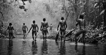 black and white photograph of few indigenous people hunting in the amazonian rain forest, insane details, dramatic lights, high definition, 35mm camera, film photography style, heavy grain, ral-chrosc-bw, masterpiece, national geographic style, strong vignette, high contrast