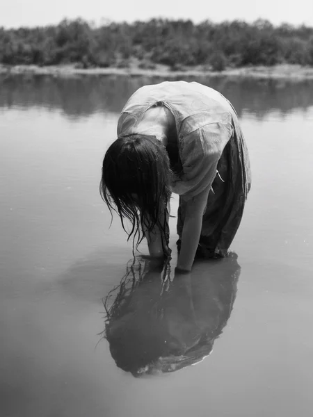 <lora:SDXL_feelings_Sa_May-v5:1> feelings, a woman is looking down at a water