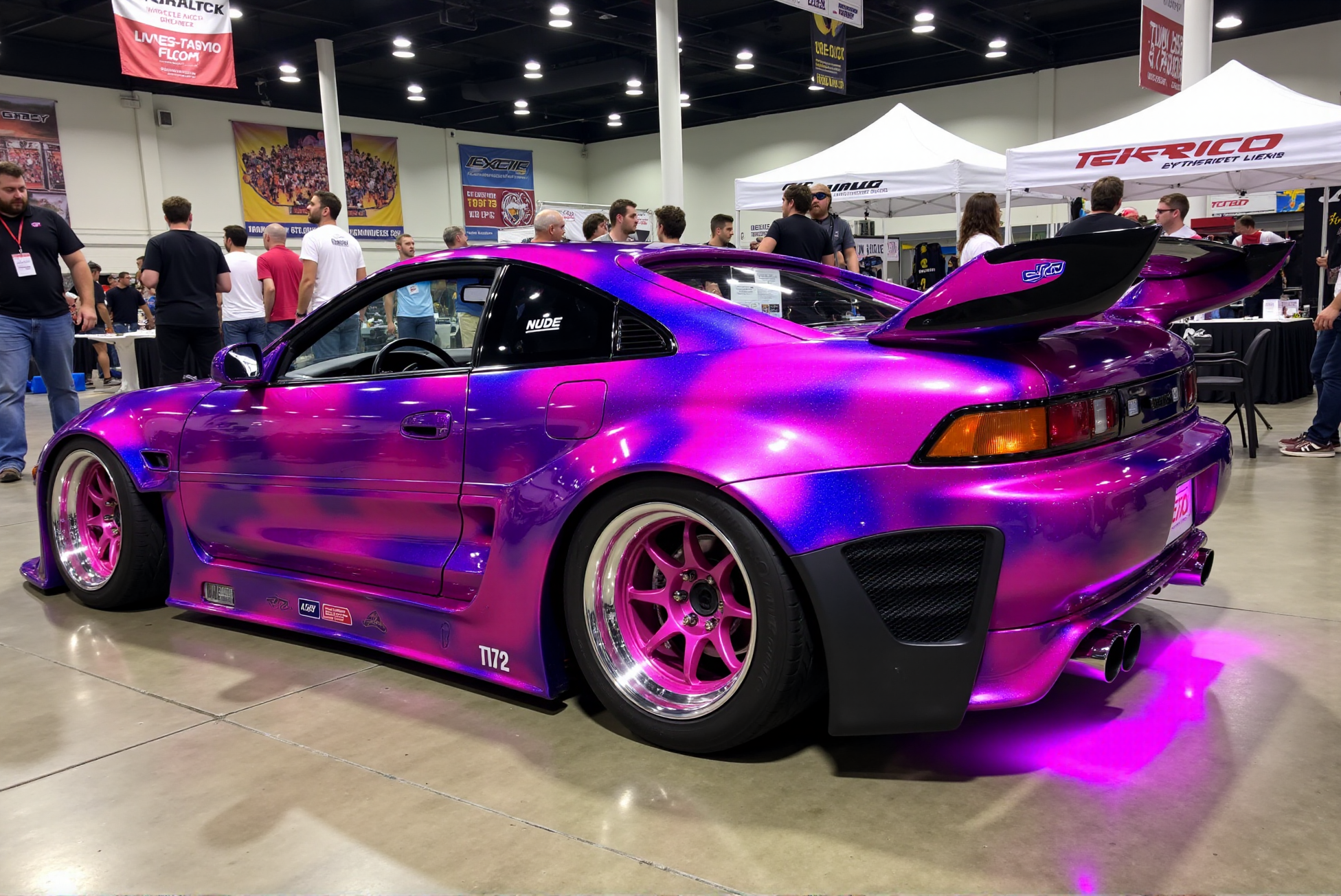 <lora:Toyota_MR2_SW20:0.8> 
A fully modified Toyota MR2 (SW20) showcased at an indoor car show, wrapped in a vibrant cosmic-inspired magenta and violet marble pattern with smoky nebula effects swirling across the bodywork. The widebody kit includes flared fenders secured with exposed hardware, housing deep-dish pink and chrome multi-piece wheels with aggressive negative camber and stretched tires. A black roof wrap with white vinyl decals flows into a bold ducktail spoiler, while underglow neon LED lighting in bright magenta adds an ethereal glow beneath the chassis. Sharp-edged side skirts, a custom vented hood, and ultra-low air suspension give the car an aggressive, track-meets-show stance, with a âNUDEâ sticker in the rear quarter window adding character. DoubleStream Style Layer: high-contrast show car photography with colorful indoor lighting and polished concrete reflections, palette of magenta, violet, neon pink, and chrome, street-tuner fusion aesthetic blending JDM culture with vaporwave tones, low-slung wide-angle profile emphasizing stance and wrap flow, high-gloss finish with matte carbon details and fluorescent underglow, set within a convention backdrop filled with vibrant modified vehicles and branded canopy tents.