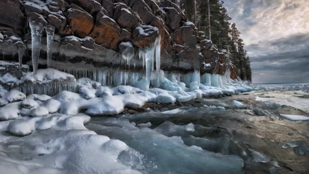 CINEMATIC SHOT, professional photo by Caravaggio of wild nature, Russia, winter, snow, woods, cliffs, icicles, dramatic clouds, rule of thirds, view from surface, (by Christopher Nolan:1.4),F11,(DOF, Cinematic Color grading, intricate, hyper realistic, detailed, flickr, cinematic lighting) <lora:Wild_nature_XL:1>