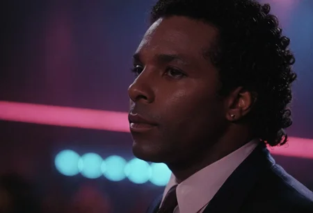 cinematic film still (Rico Tubbs), MiamiVice, indoors, club, neon lights, closeup . shallow depth of field, vignette, highly detailed, high budget, bokeh, cinemascope, moody, epic, gorgeous, film grain, grainy